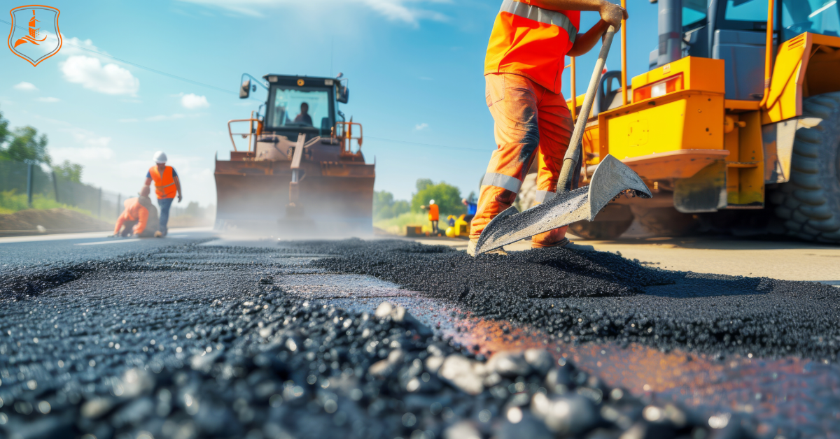 Asphalt paving crew and equipment resurfacing a highway in Dallas–Fort Worth, Texas — representing Eastman Insurance Solutions’ specialized insurance for asphalt and paving contractors.