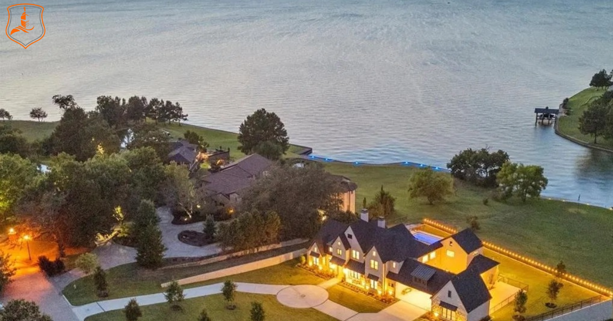 Aerial view of a lakefront home in Rockwall County, Texas, at sunset near Lake Ray Hubbard, representing personalized insurance coverage from Eastman Insurance Solutions.
