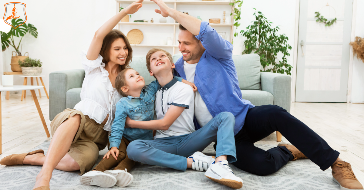 Happy Texas family sitting on the floor of their home, symbolizing protection and security provided by term life insurance.
